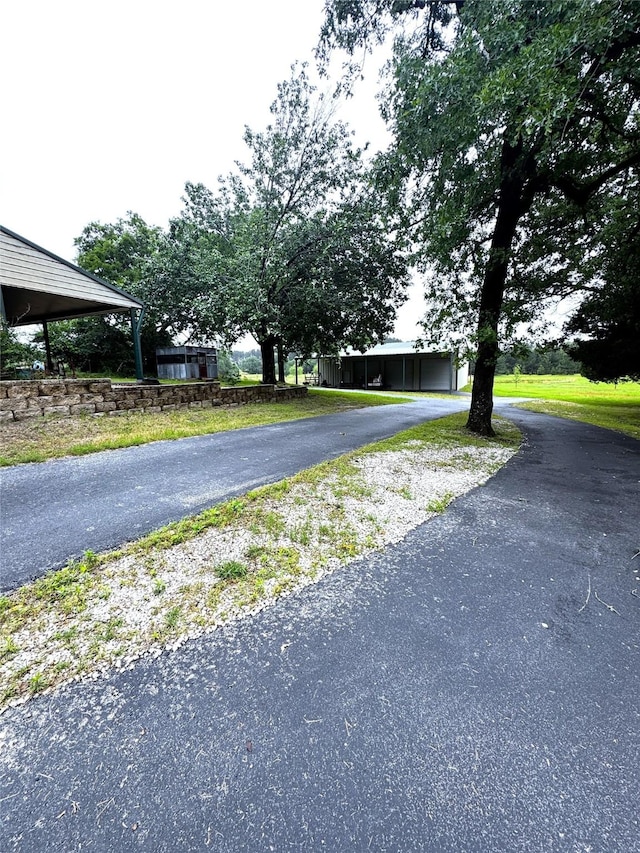 view of road with driveway