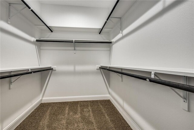 10185 Budtime Ln, Dallas, TX 75217 - bathroom with double vanity, a stall shower, baseboards, and marble finish flooring