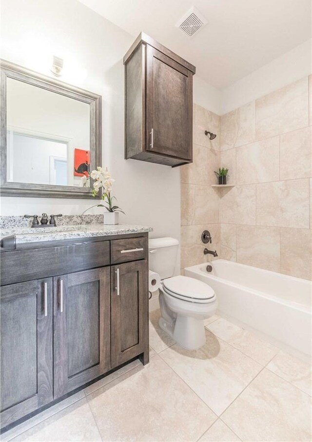 10185 Budtime Ln, Dallas, TX 75217 - laundry room featuring separate washer and dryer, cabinet space, and light tile patterned floors