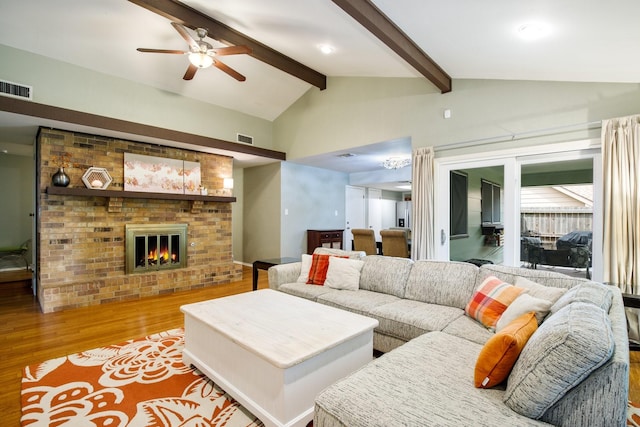 2403 Leslie St, Denton, TX 76205 - living room featuring wood finished floors, ceiling fan, and a fireplace