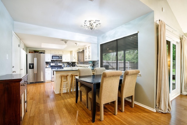 2403 Leslie St, Denton, TX 76205 - dining room with light wood-type flooring, plenty of natural light, and baseboards