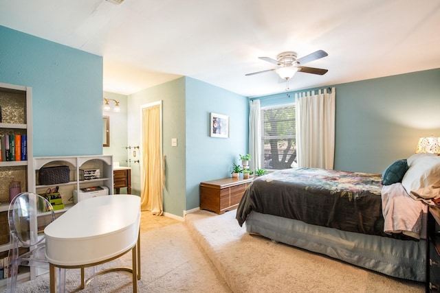 2403 Leslie St, Denton, TX 76205 - bedroom featuring light colored carpet, connected bathroom, a ceiling fan, and baseboards