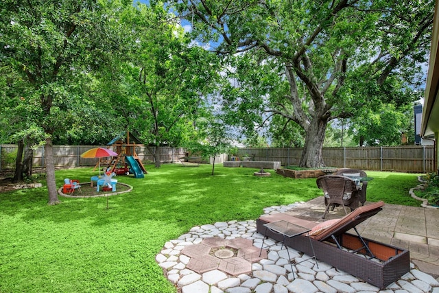 2403 Leslie St, Denton, TX 76205 - view of yard with a patio and a playground