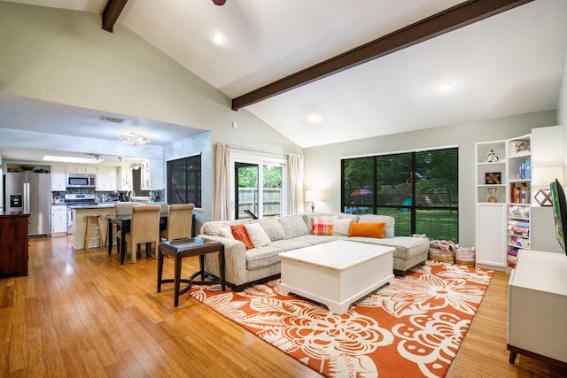2403 Leslie St, Denton, TX 76205 - living area featuring beamed ceiling, light wood-style flooring, high vaulted ceiling, and recessed lighting