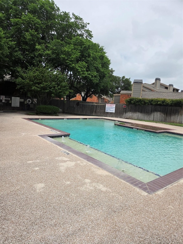 pool featuring fence