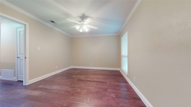 spare room featuring crown molding, ceiling fan, wood finished floors, and visible vents