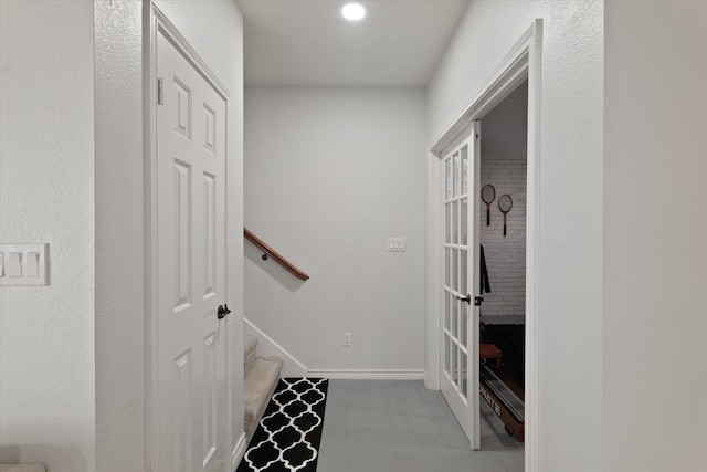 interior space with stairway, tile patterned floors, and french doors