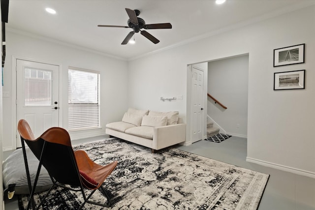 living room with crown molding, ceiling fan, stairs, recessed lighting, and baseboards