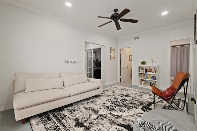 living room featuring crown molding, a ceiling fan, baseboards, and recessed lighting