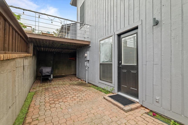 doorway to property featuring a balcony