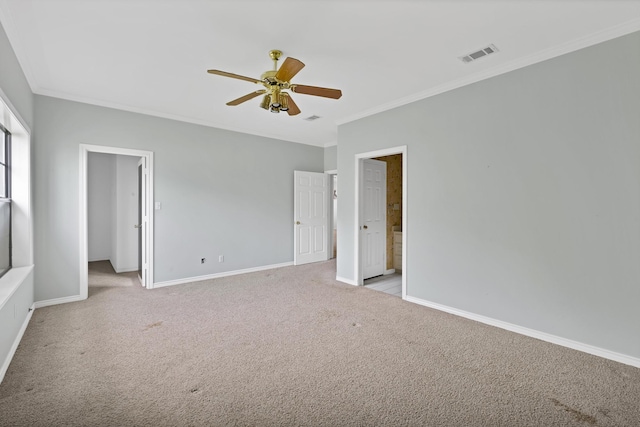unfurnished bedroom with baseboards, visible vents, ornamental molding, and light carpet