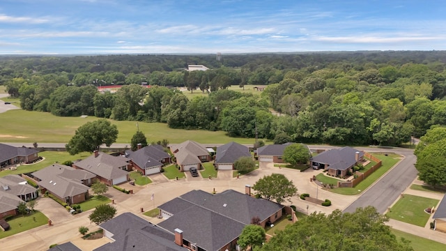bird's eye view featuring a residential view and a forest view