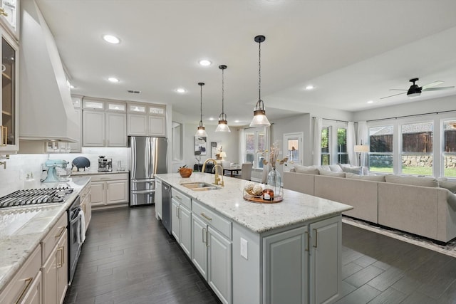 1146 Berrydale Dr, Northlake, TX 76226 - kitchen featuring stainless steel appliances, an island with sink, white cabinetry, dark wood-type flooring, and recessed lighting