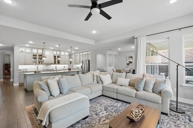 1146 Berrydale Dr, Northlake, TX 76226 - living area featuring ceiling fan, arched walkways, recessed lighting, and dark wood-style flooring