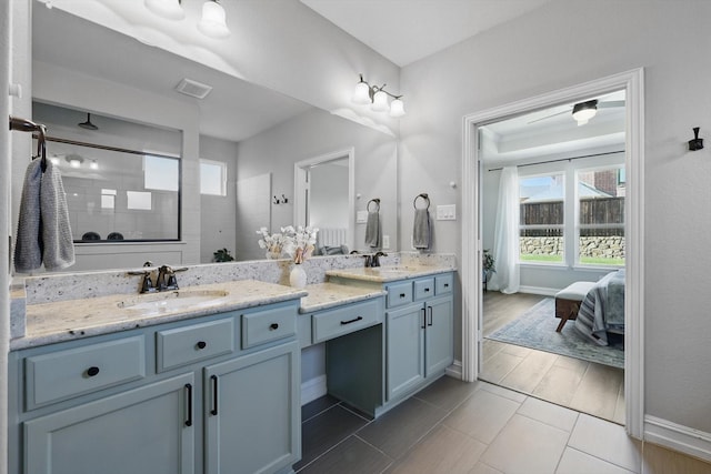 1146 Berrydale Dr, Northlake, TX 76226 - ensuite bathroom featuring double vanity, healthy amount of natural light, and a tile shower