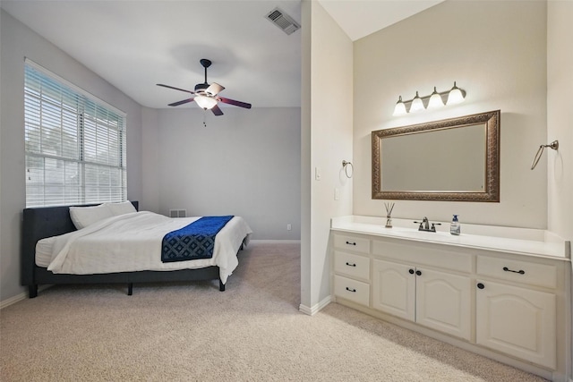 619 Uvalde Ct, Allen, TX 75013 - bedroom featuring ceiling fan, light colored carpet, visible vents, a sink, and baseboards
