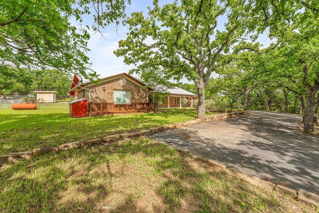 exterior space featuring fence and a wooden deck