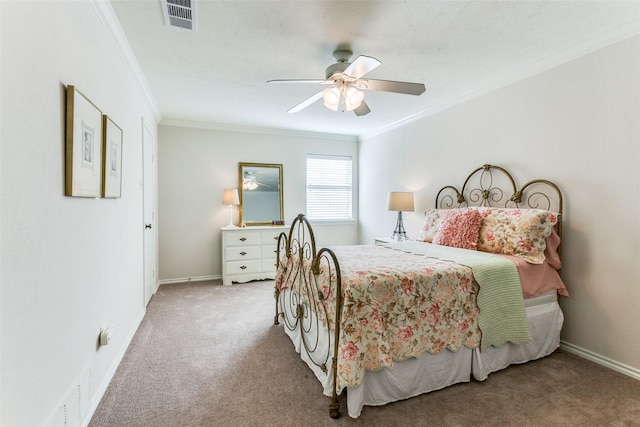 carpeted bedroom with ornamental molding, a ceiling fan, and baseboards