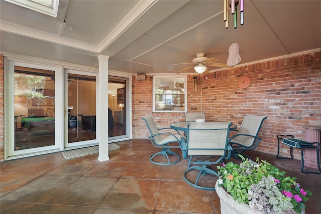 view of patio with a ceiling fan and outdoor dining area