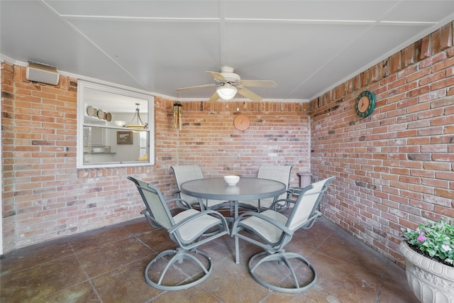 view of patio featuring a ceiling fan and outdoor dining area