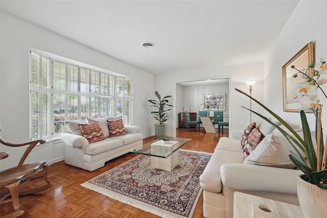 living area featuring visible vents