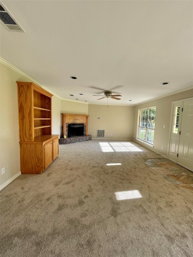 unfurnished living room with crown molding, visible vents, and light carpet
