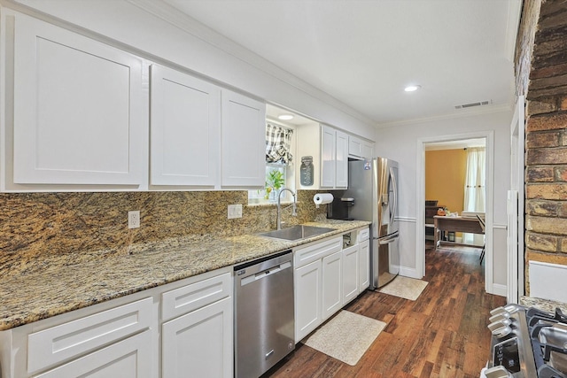 kitchen with white cabinets, a sink, visible vents, stainless steel appliances, and dark wood-type flooring