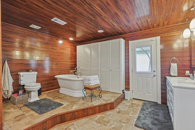full bath featuring visible vents, toilet, stone tile flooring, and wood ceiling