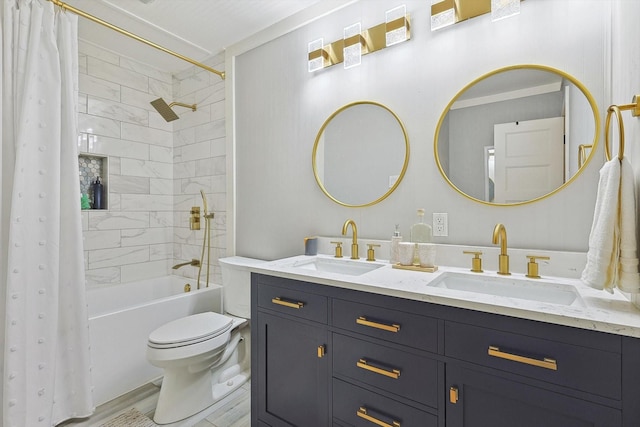 bathroom featuring double vanity, shower / bath combo with shower curtain, toilet, and a sink