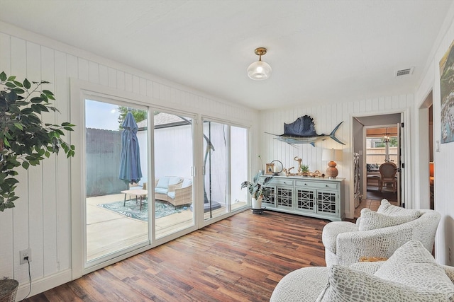 interior space with visible vents and wood finished floors