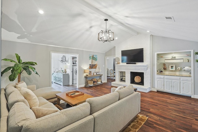 living room with an inviting chandelier, lofted ceiling with beams, visible vents, washer / clothes dryer, and dark wood finished floors