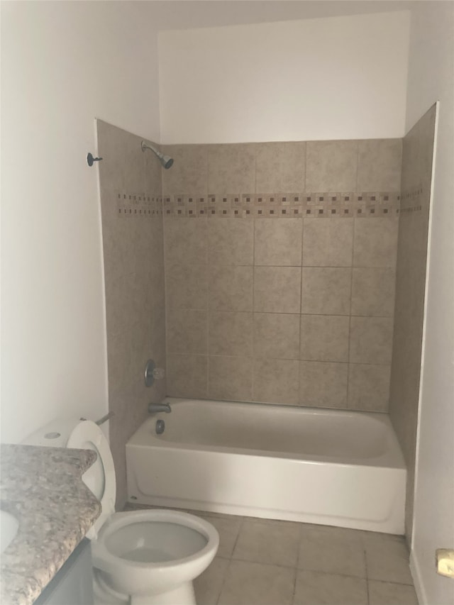 bathroom featuring toilet, shower / bathing tub combination, tile patterned flooring, and vanity