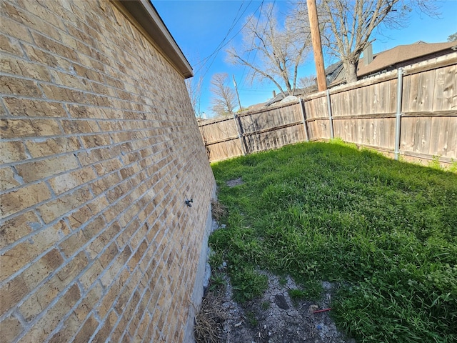 view of yard with a fenced backyard