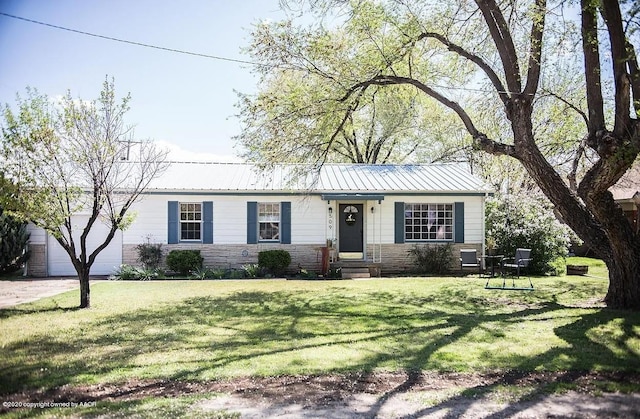 509 W 3rd St, Claude, TX 79019 - ranch-style house featuring metal roof, a front yard, and stone siding