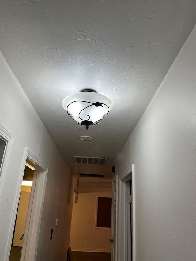 509 W 3rd St, Claude, TX 79019 - hallway featuring visible vents