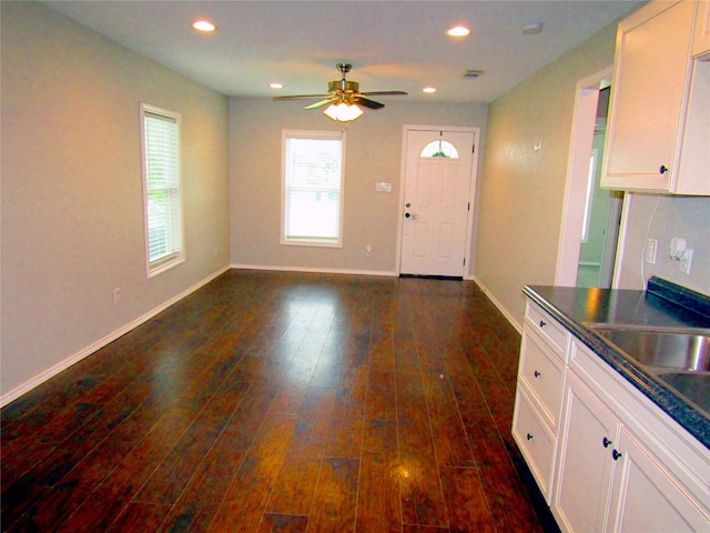 316 Tennessee St, Graham, TX 76450 - kitchen featuring recessed lighting, dark countertops, white cabinetry, a ceiling fan, and dark wood-style floors
