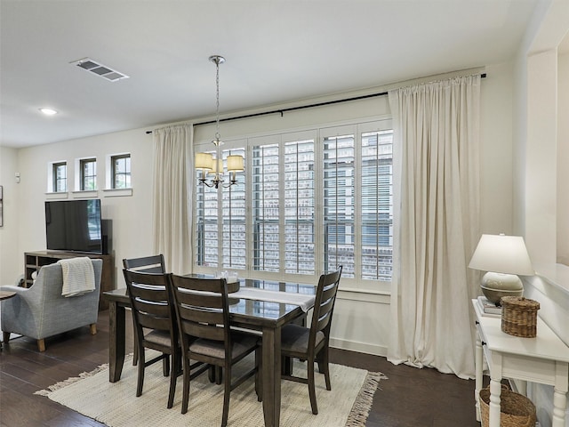 1267 Casselberry Dr, Flower Mound, TX 75028 - dining area with a notable chandelier, dark wood finished floors, and visible vents