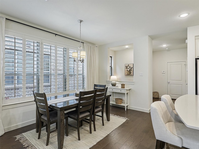 1267 Casselberry Dr, Flower Mound, TX 75028 - dining space with a healthy amount of sunlight, baseboards, an inviting chandelier, and dark wood-style floors