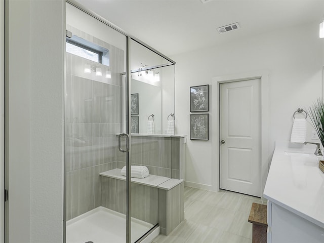 1267 Casselberry Dr, Flower Mound, TX 75028 - full bath featuring a shower stall, visible vents, a sink, and double vanity