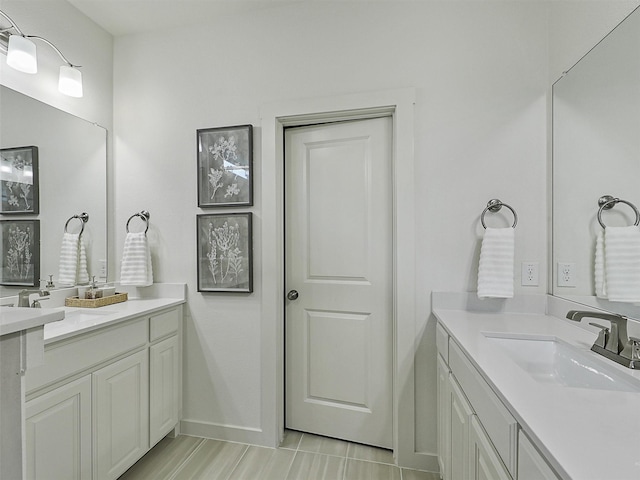 1267 Casselberry Dr, Flower Mound, TX 75028 - bathroom featuring a sink, two vanities, and baseboards