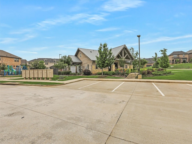 1267 Casselberry Dr, Flower Mound, TX 75028 - uncovered parking lot with a residential view and mail area