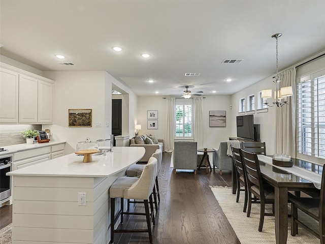 1267 Casselberry Dr, Flower Mound, TX 75028 - kitchen featuring recessed lighting, visible vents, white cabinetry, and dark wood finished floors