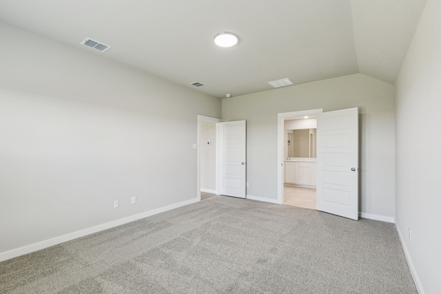 6517 Colt Ranch Rd, Fort Worth, TX 76036 - unfurnished bedroom with light colored carpet, ensuite bath, and vaulted ceiling