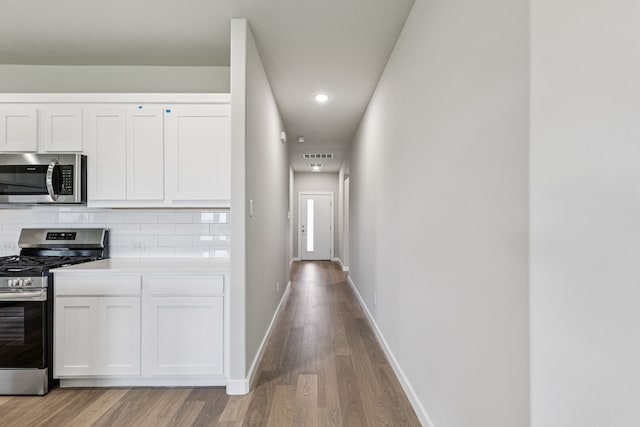 6517 Colt Ranch Rd, Fort Worth, TX 76036 - corridor featuring light wood-type flooring and recessed lighting