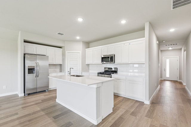 6517 Colt Ranch Rd, Fort Worth, TX 76036 - kitchen featuring appliances with stainless steel finishes, backsplash, white cabinetry, and recessed lighting