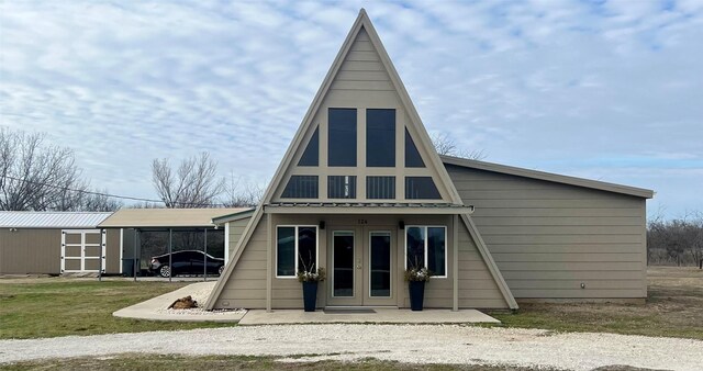 124 Greenhill Cir, Nocona, TX 76255 - rear view of house featuring an outbuilding, french doors, and a storage unit