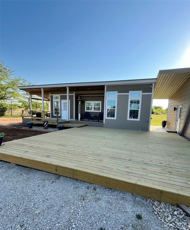 124 Greenhill Cir, Nocona, TX 76255 - back of property with a deck