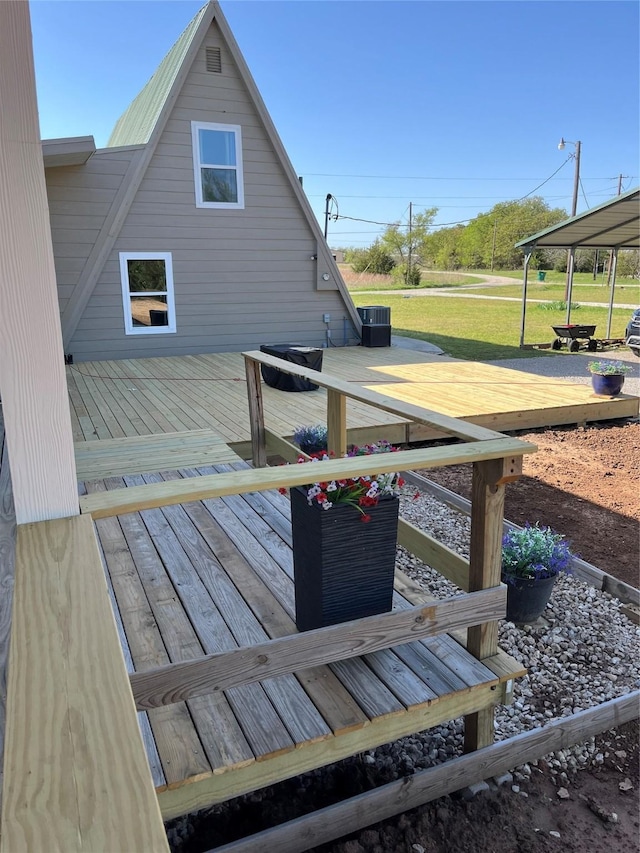 124 Greenhill Cir, Nocona, TX 76255 - wooden terrace with cooling unit and a lawn