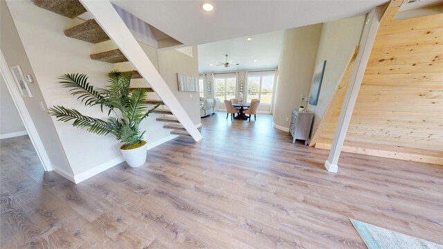 entrance foyer with recessed lighting, stairway, wood finished floors, and baseboards