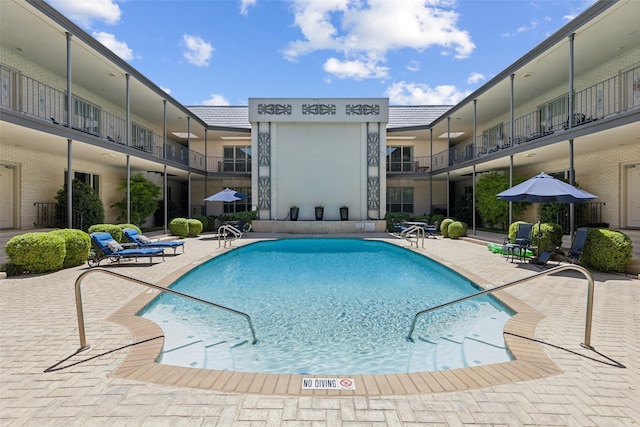 pool with a patio
